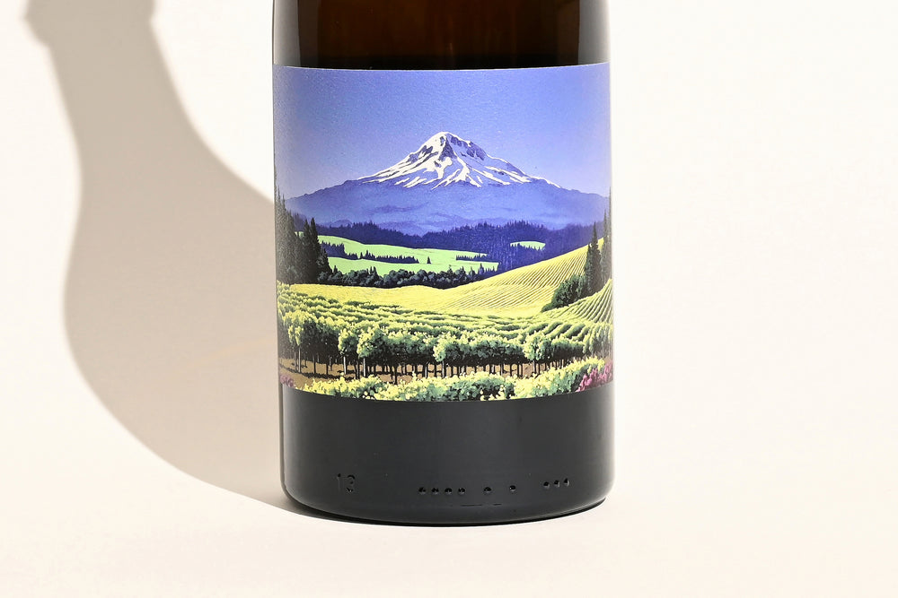 Close-up of Swick Wines 2022 Gewurztraminer bottle label featuring scenic Mt. Hood mountain landscape with green vineyard fields
